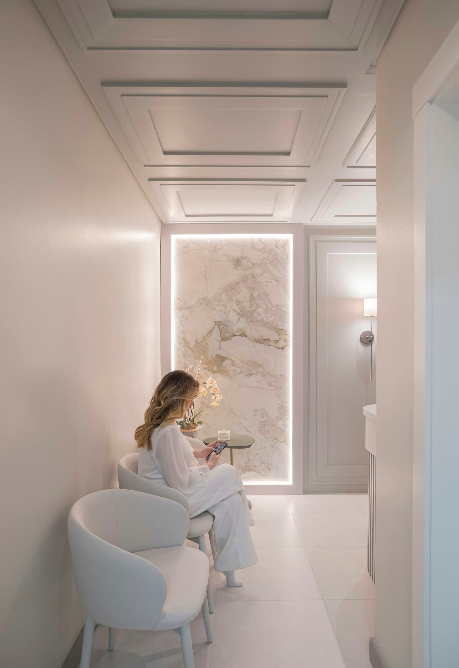 The calm, warmly lit waiting area at Ferngate Dental